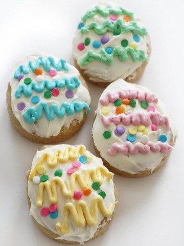 four finished vegan easter egg cupcakes with frosting decorations