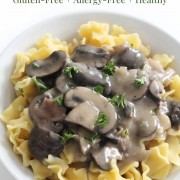 vegan mushroom stroganoff with gluten-free noodles with image text