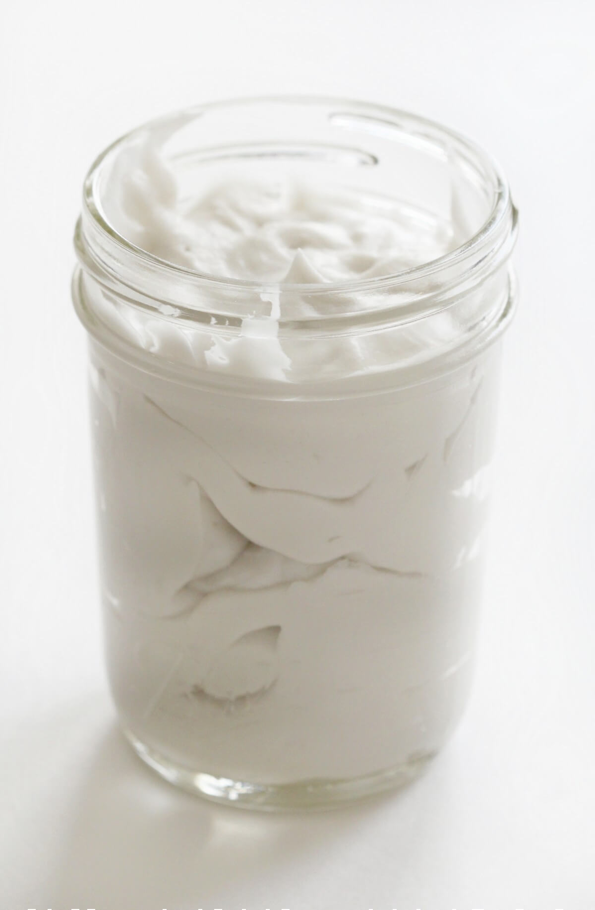 small mason jar filled with coconut whipped cream
