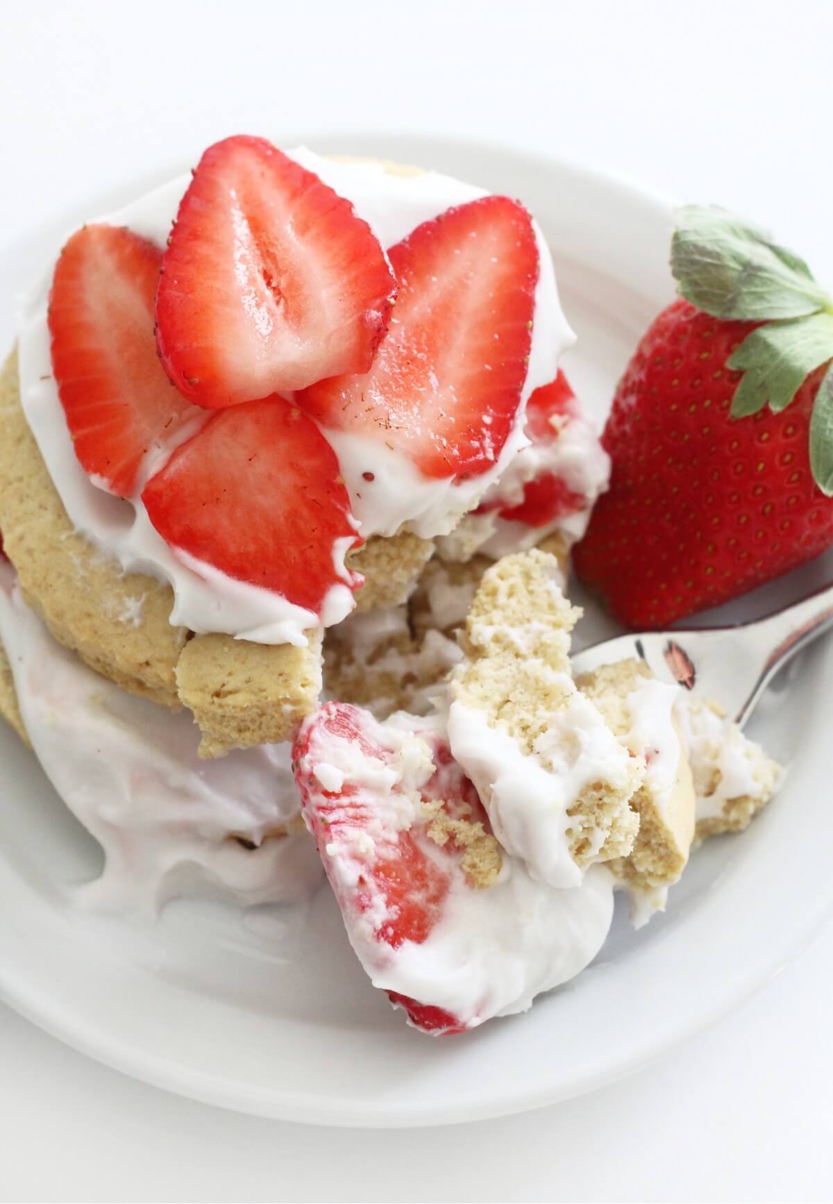 close up of forkful bite of individual gluten-free strawberry shortcake
