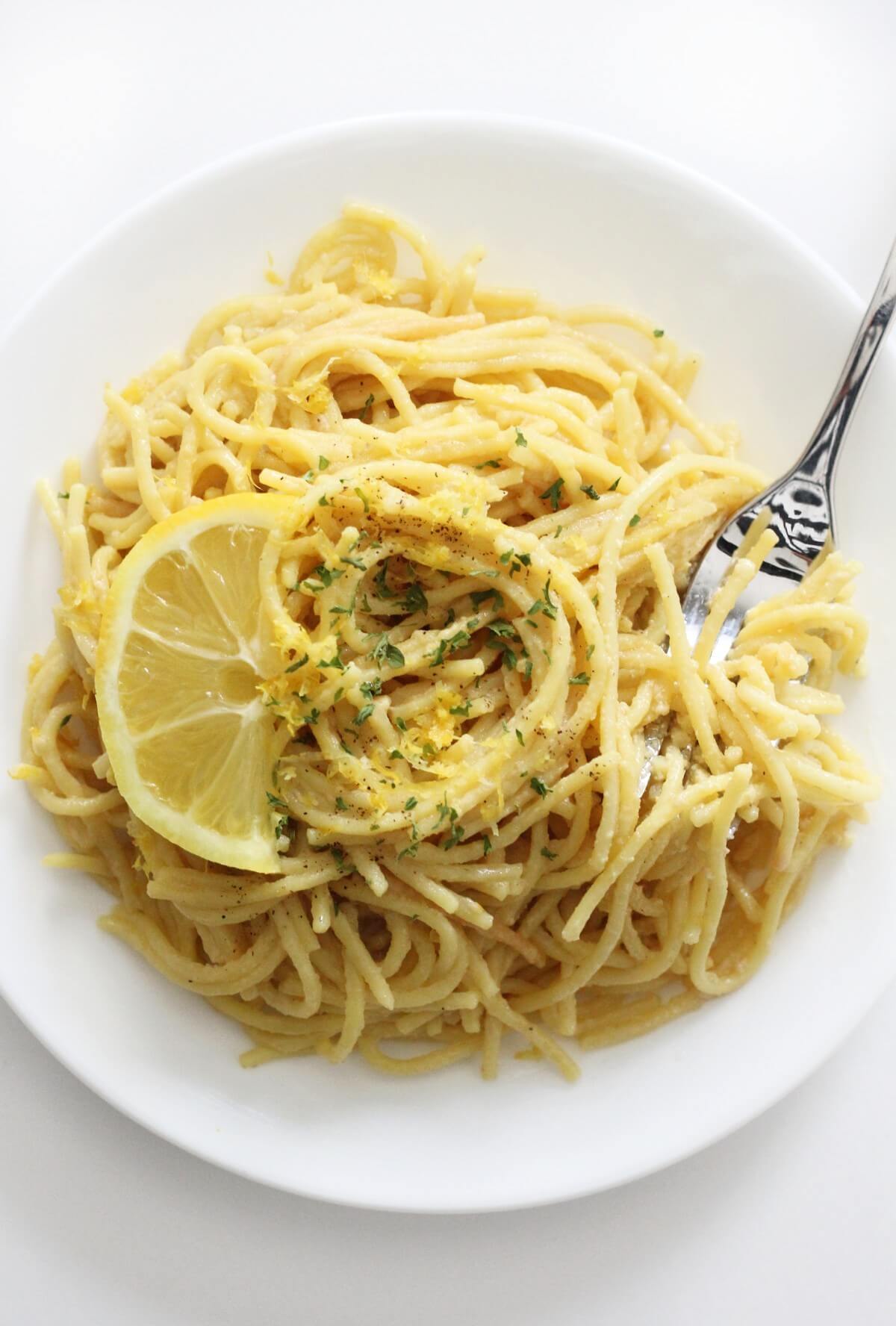 vegan pasta al limone on a plate with fork