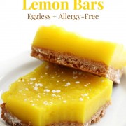 two vegan lemon bars on white plate with image text