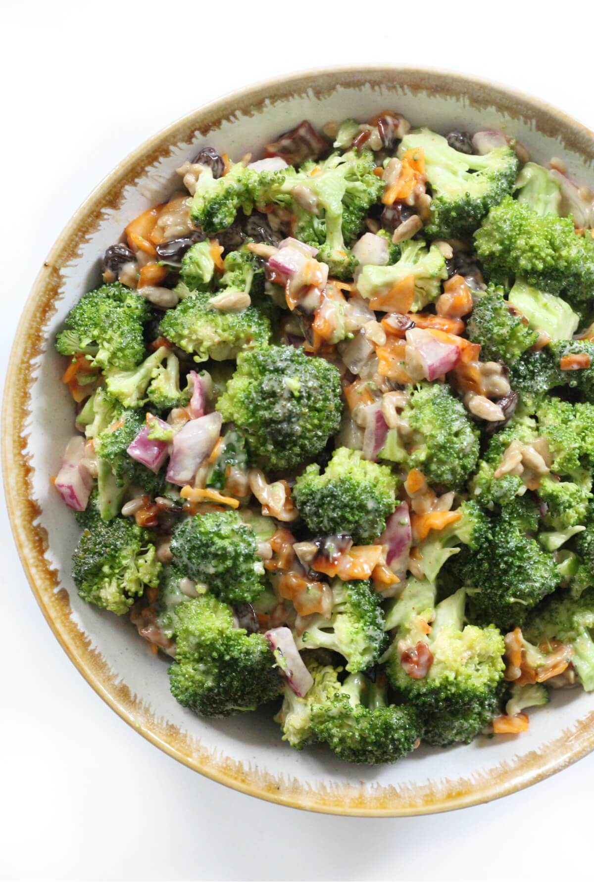half a bowl of vegan broccoli salad