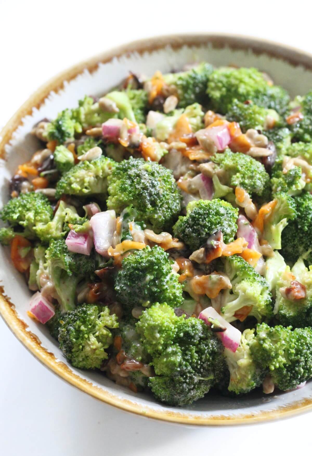 close up of vegan broccoli salad in bowl