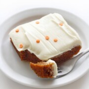 slice of gluten-free pumpkin cake on plate with fork bite