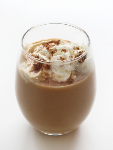 one finished hot vegan pumpkin spice latte in glass