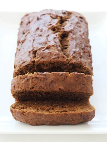 loaf of gingerbread banana bread with end slices cut