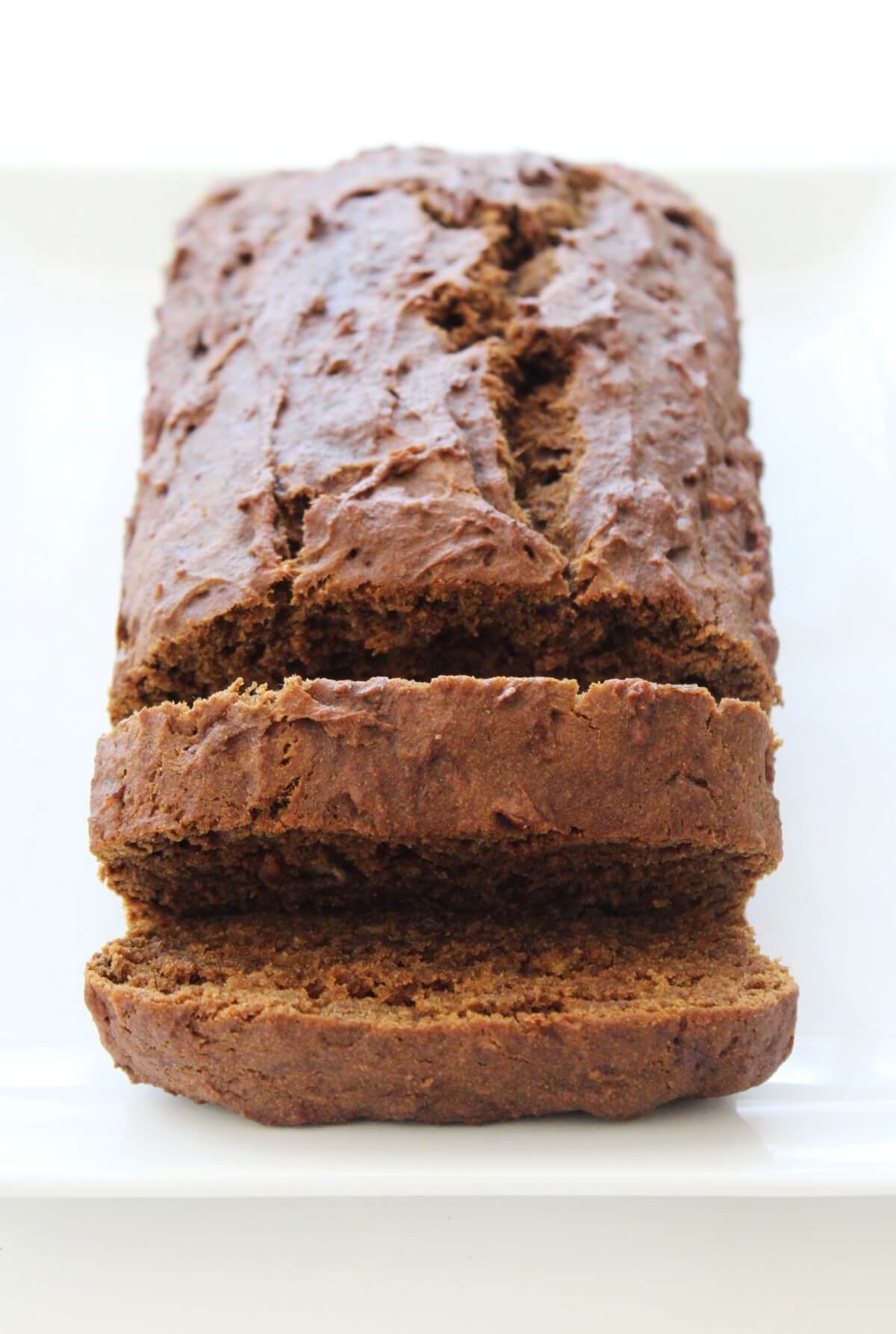 loaf of gingerbread banana bread with end slices cut