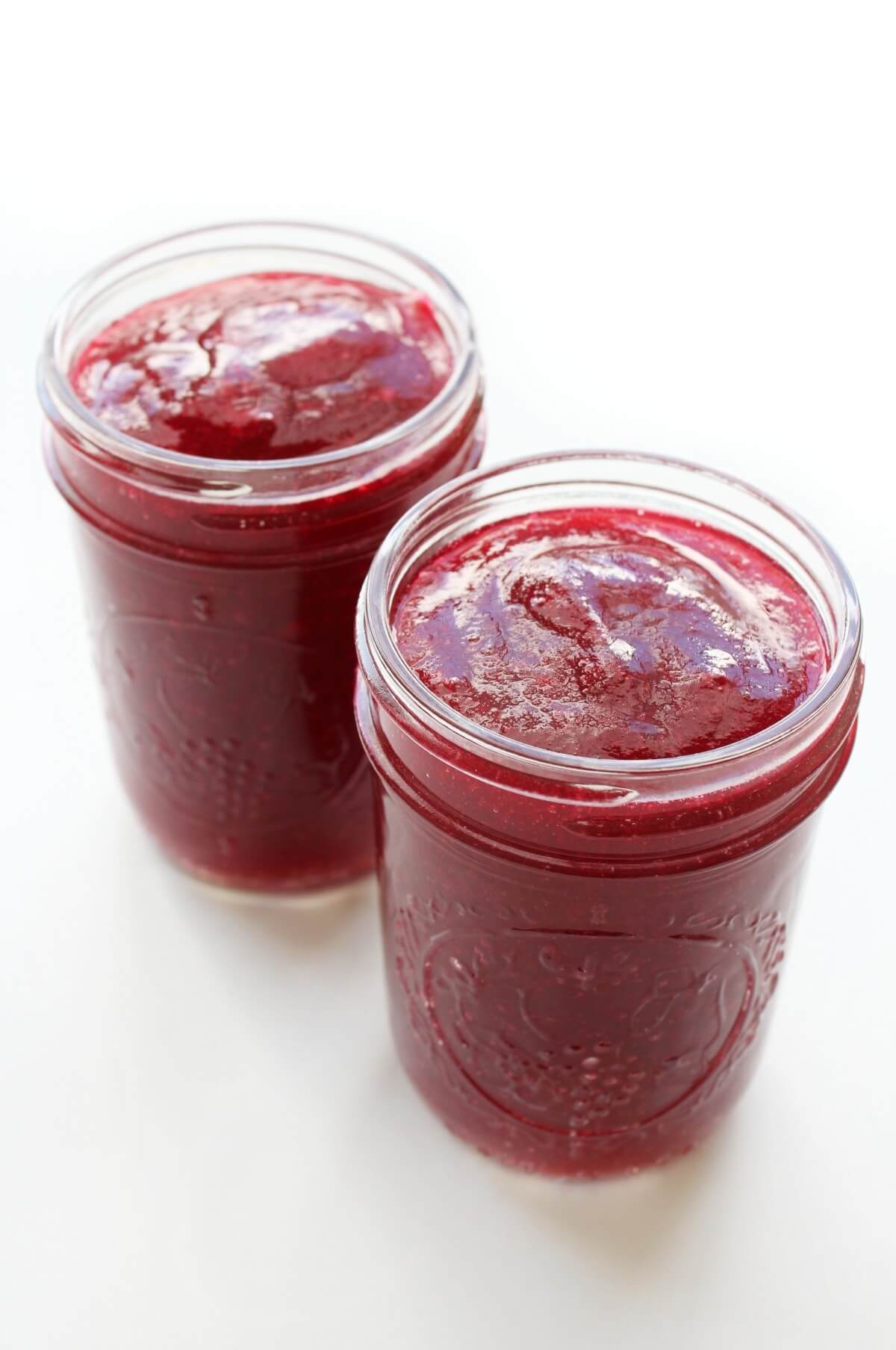 two glass jars with jellied cranberry sauce
