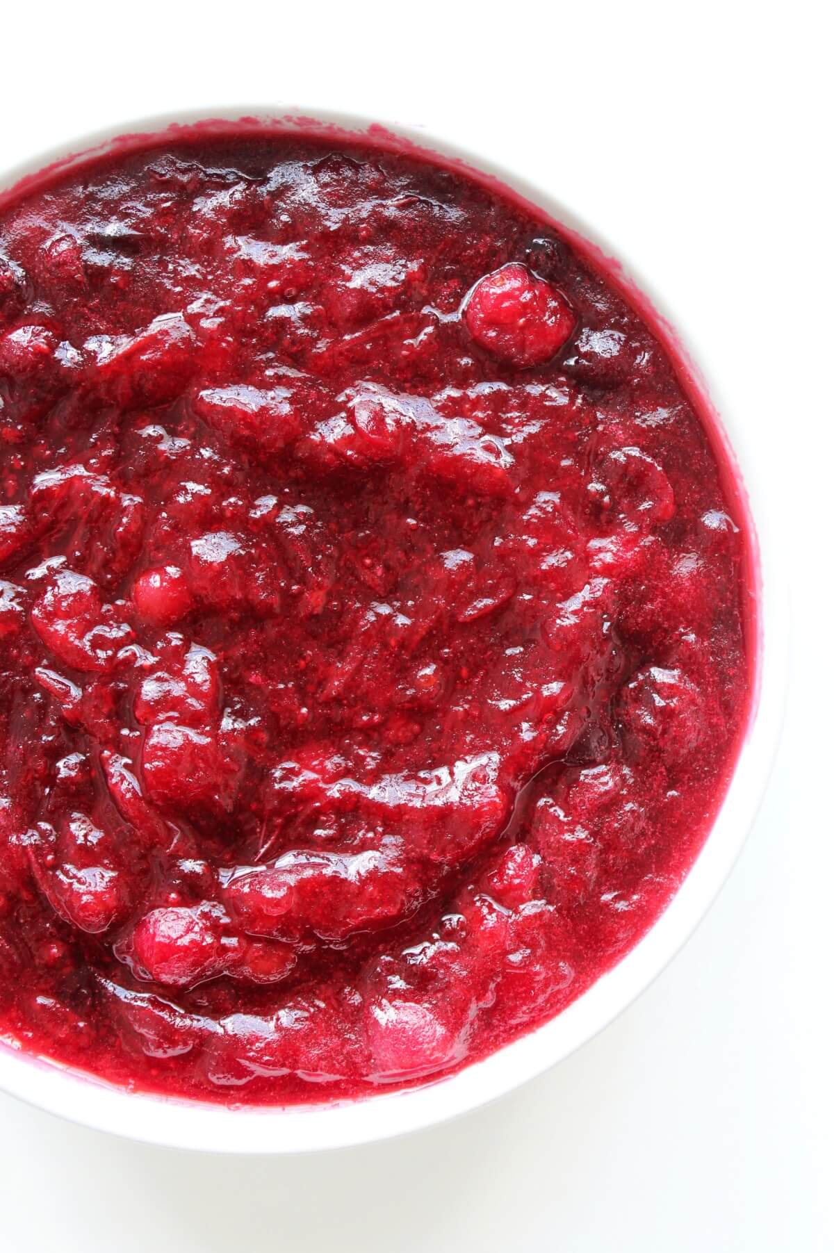 half bowl of whole berry cranberry sauce