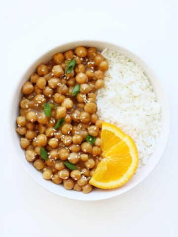 overhead view of finished bowl of vegan orange chicken chickpeas and rice