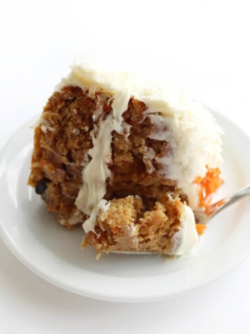 plate with slice of gluten-free vegan carrot cake ready to eat