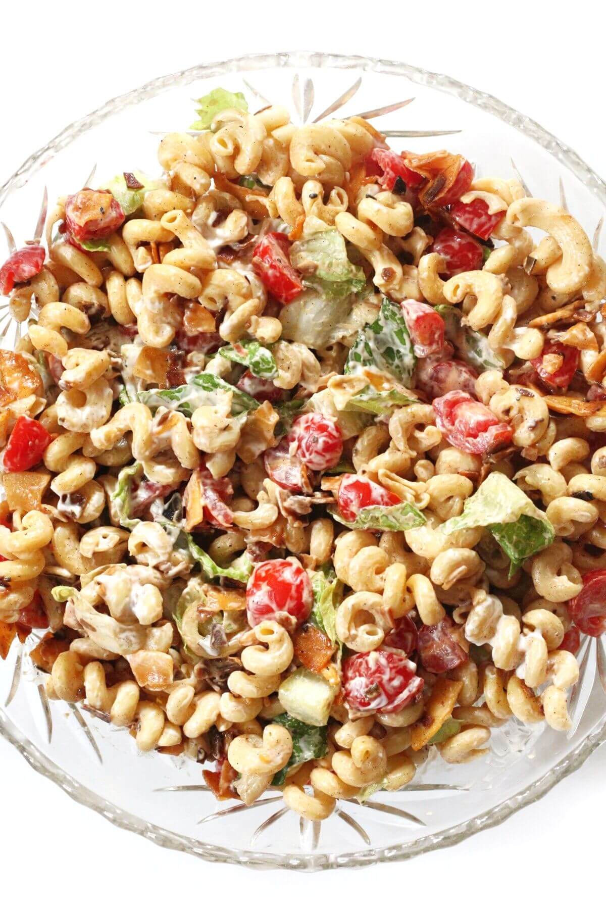 close up overhead of vegan blt pasta salad in serving bowl