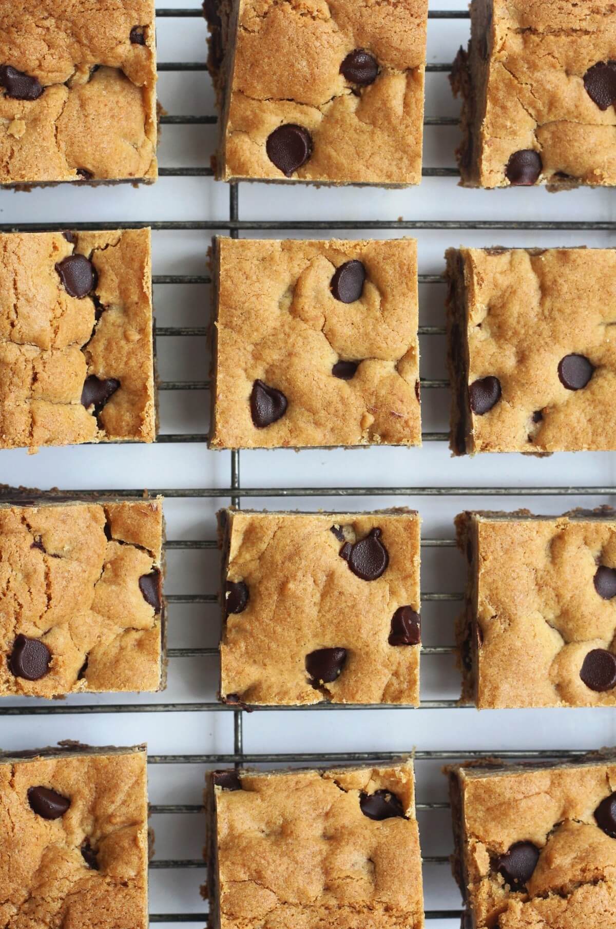 overhead close-up of chocolate chip cookie bars on wire rack