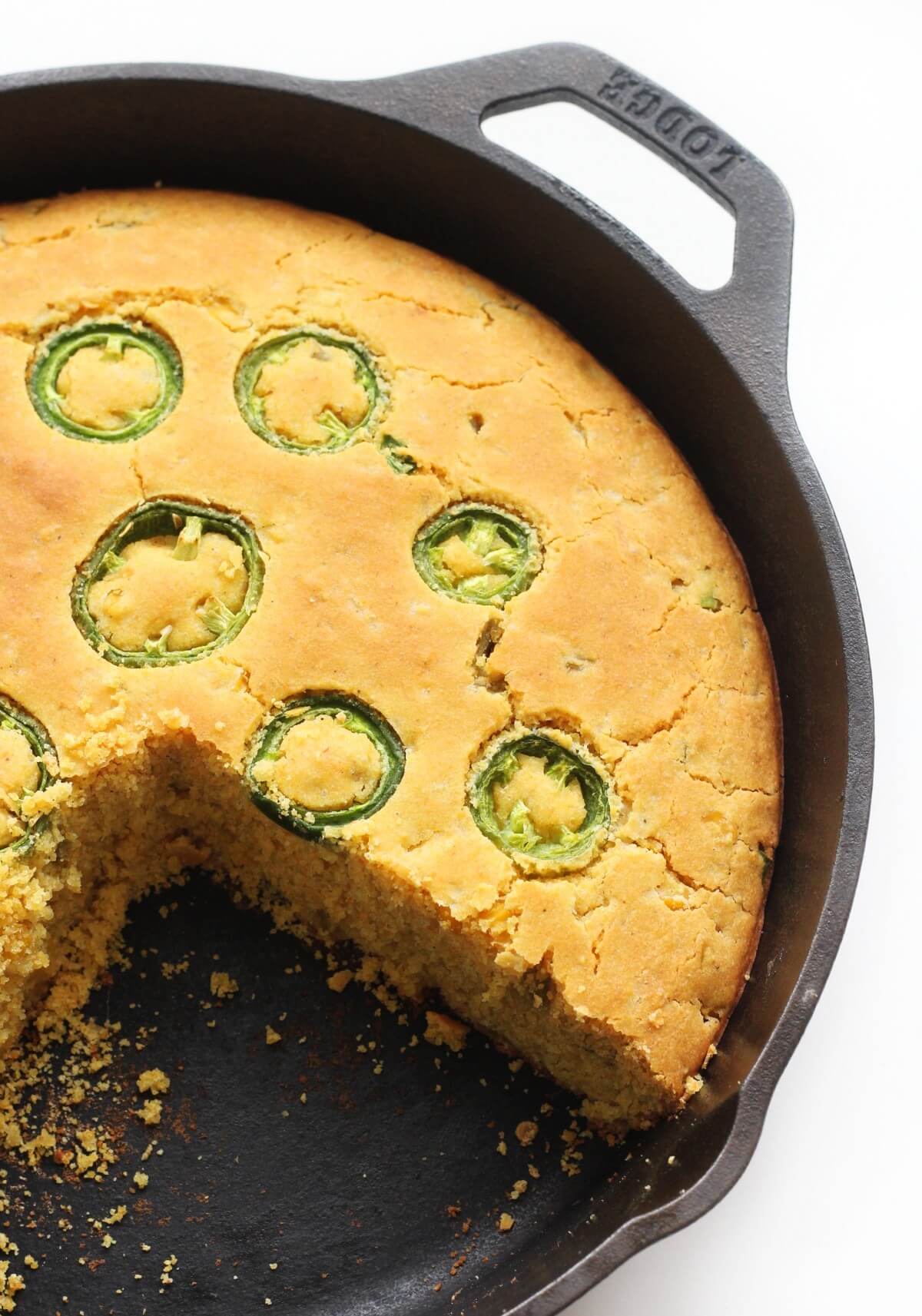 slice cut out of cast iron skillet with jalapeno cornbread