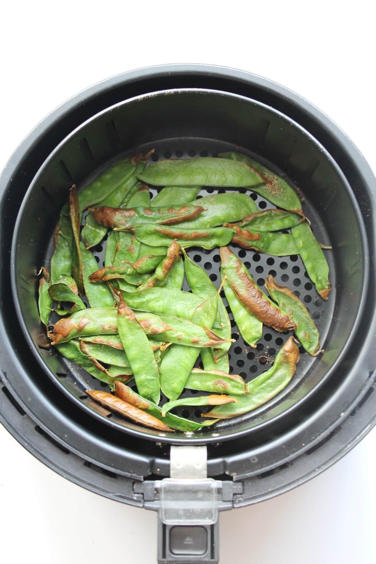 snow peas roasted in the air fryer basket