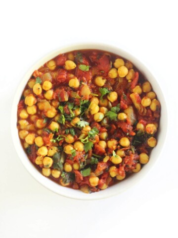 overhead view of easy chana masala in white bowl