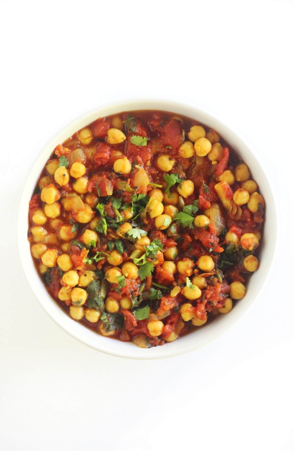 overhead view of easy chana masala in white bowl