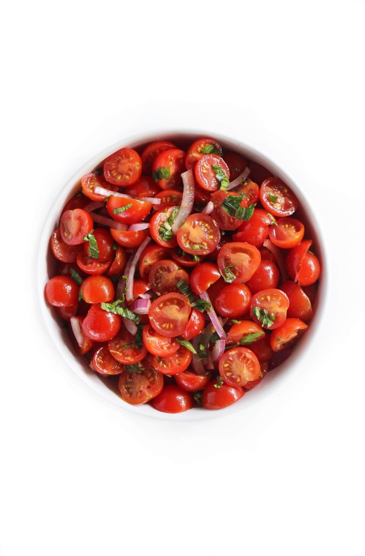 overhead zoomed out view of Italian tomato salad ready to serve