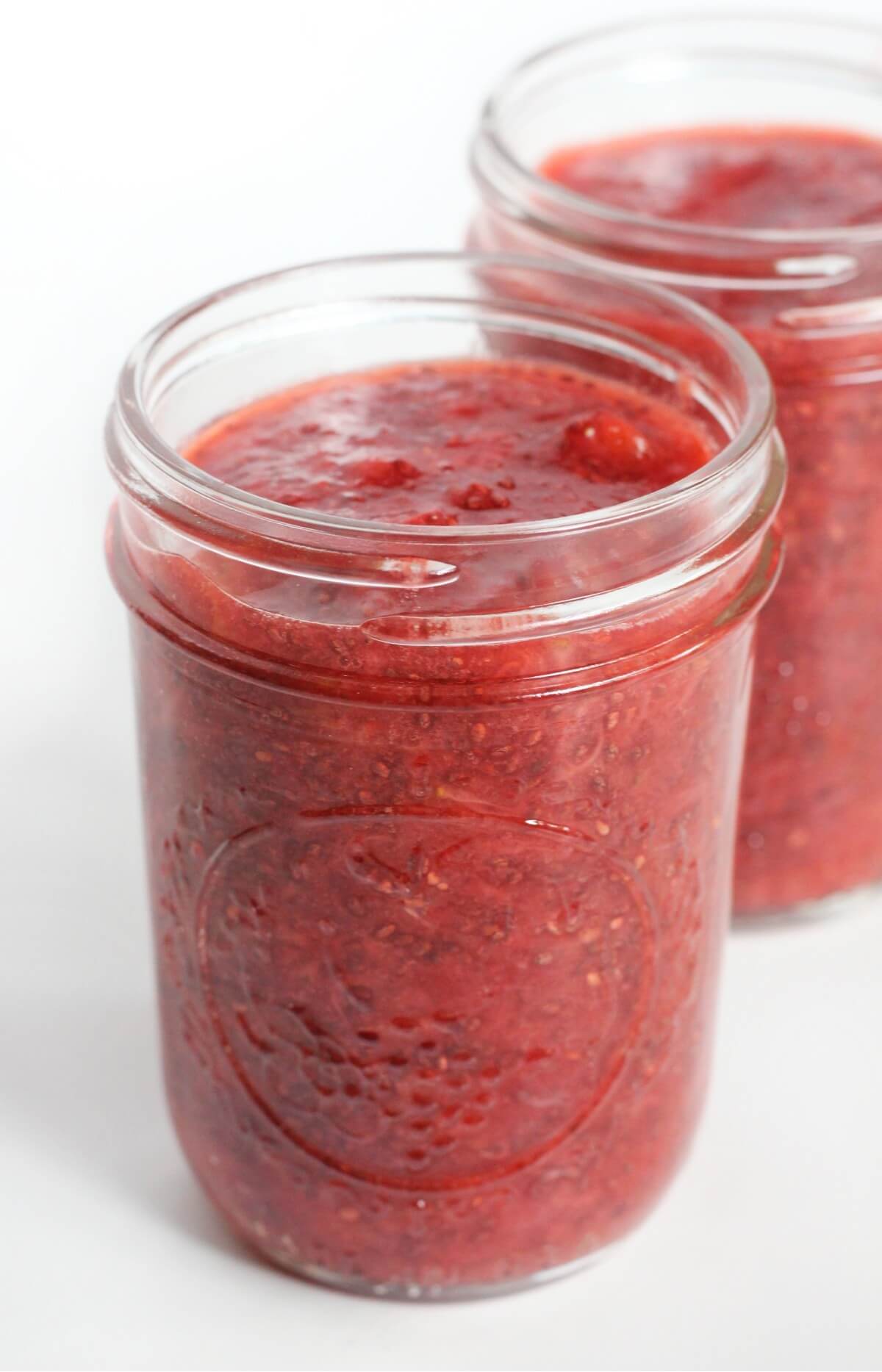 two small glass jars of homemade strawberry chia jam