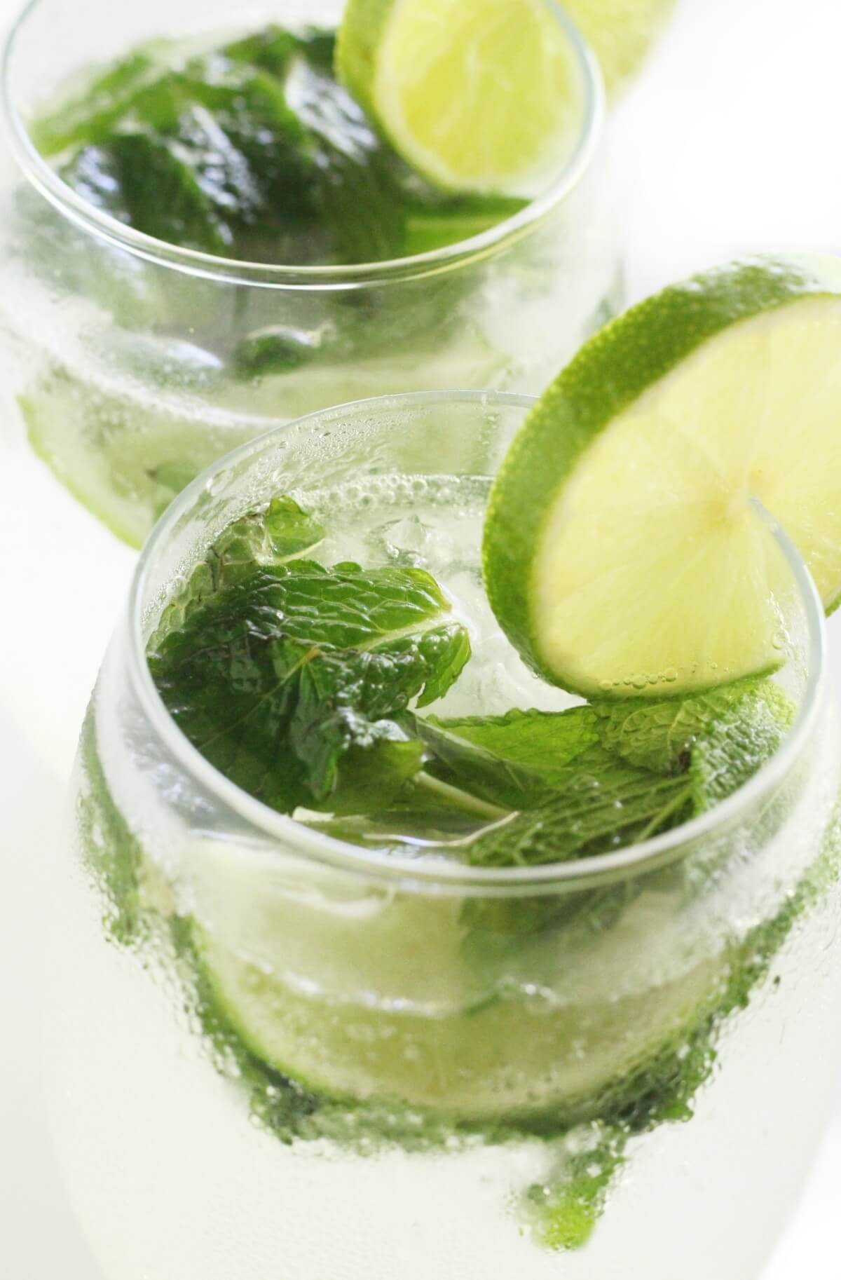 close up of two glasses of virgin mojito