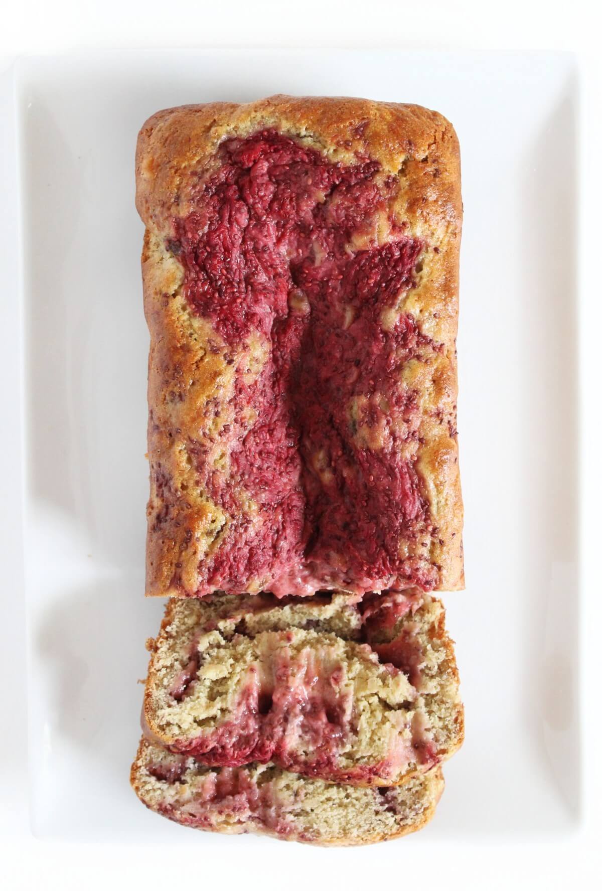 overhead view of gluten-free vegan strawberry banana bread sliced