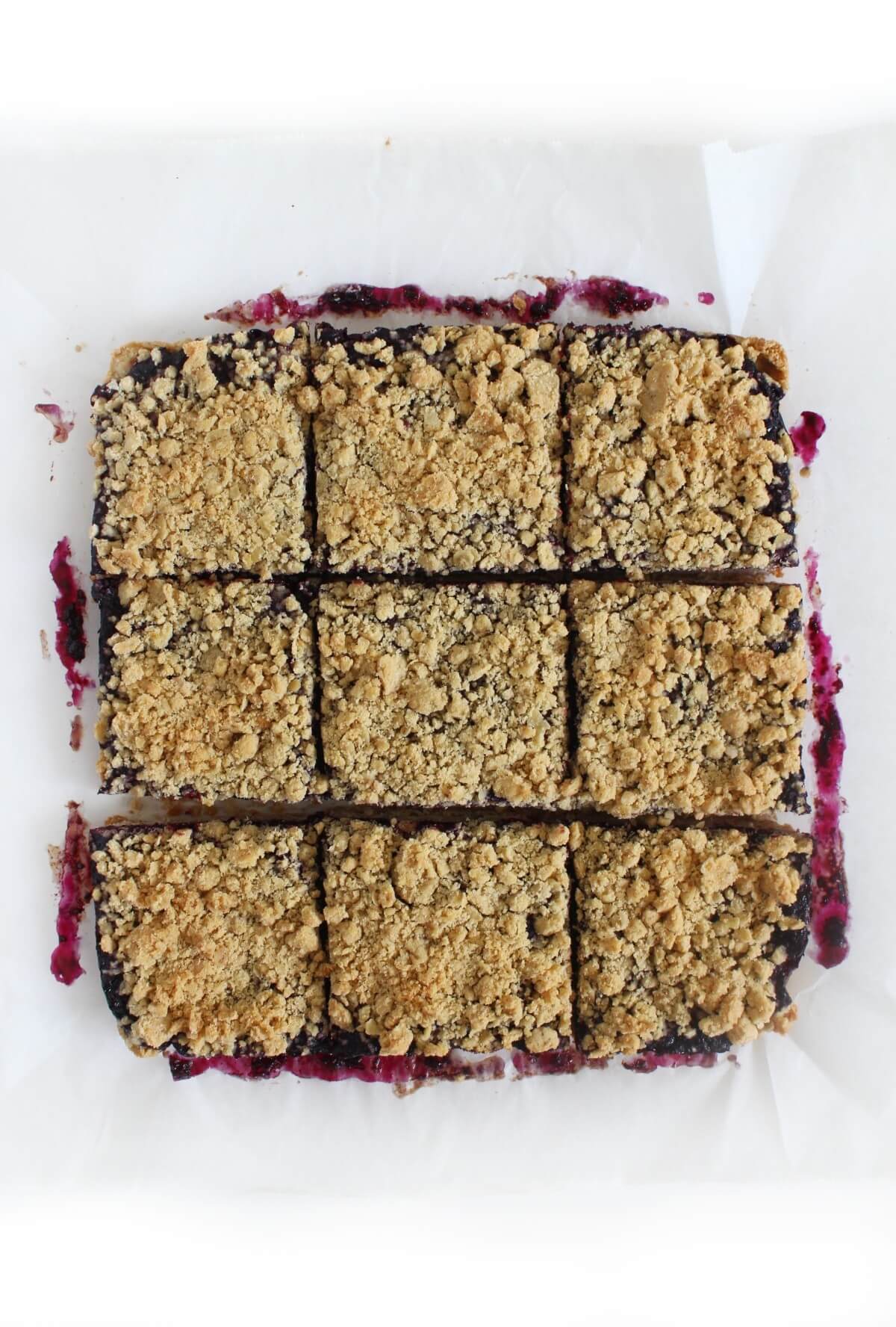 slicing the gluten-free blueberry jam bars into squares