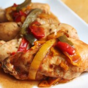 slow cooker bbq chicken breasts with bell peppers on plate