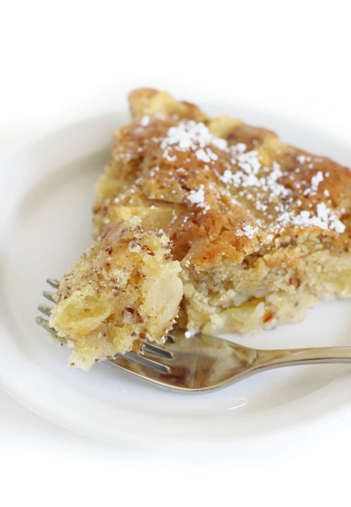 forkful of gluten-free french apple cake slice