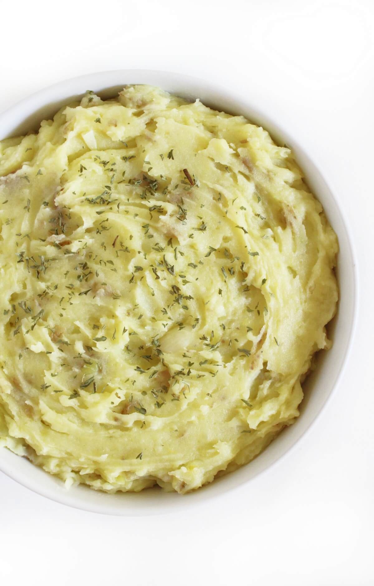half bowl of creamy garlic mashed potatoes.