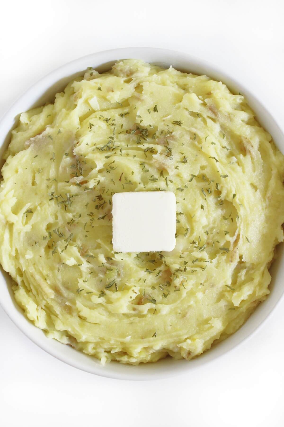 close up of creamy garlic mashed potatoes with vegan butter.