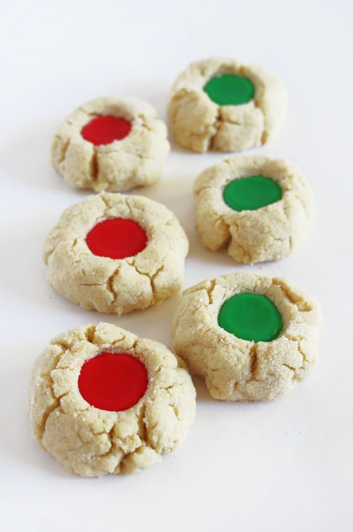 two rows of gluten-free christmas thumbprint cookies.