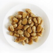 brown butter garlic gnocchi on white plate.
