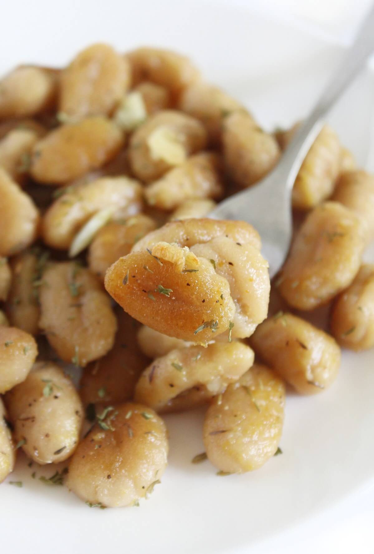 forkful showing crispy gluten-free gnocchi.