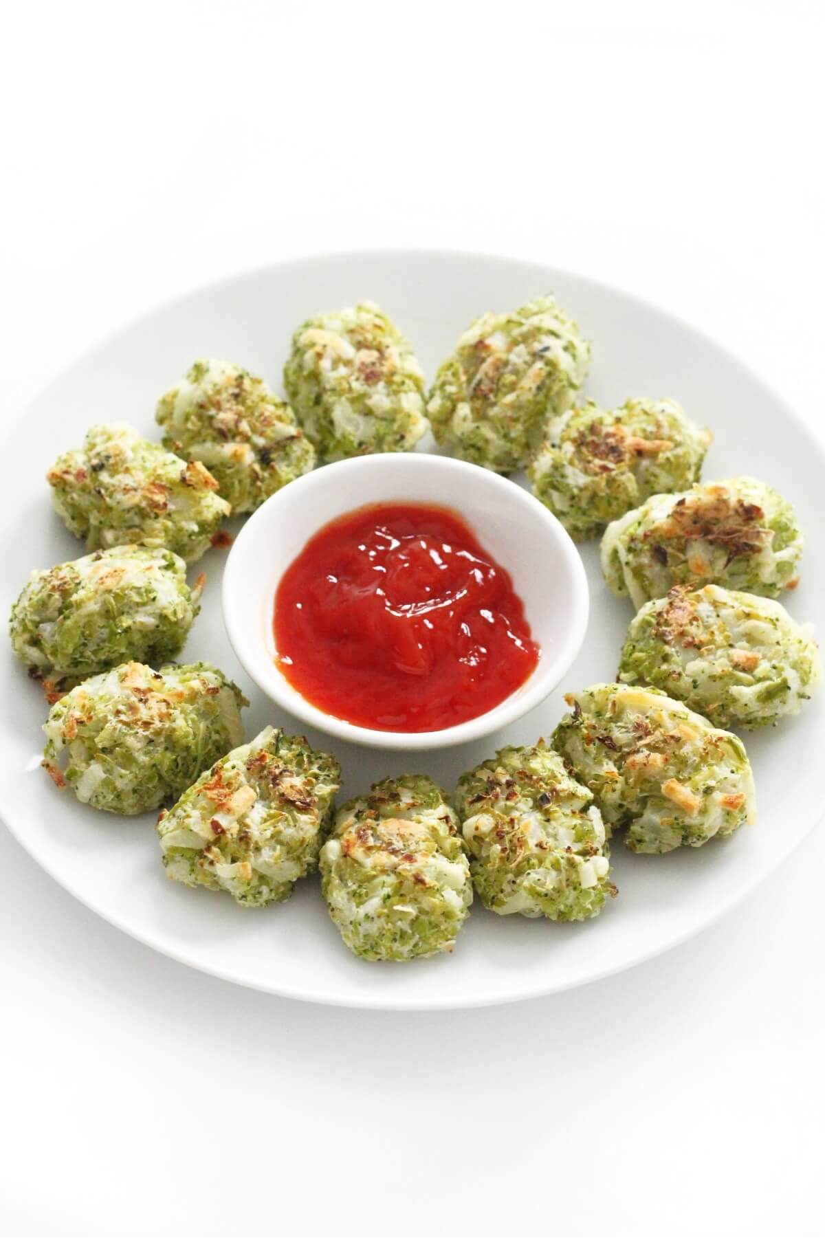 plate of broccoli tater tots with ketchup bowl.
