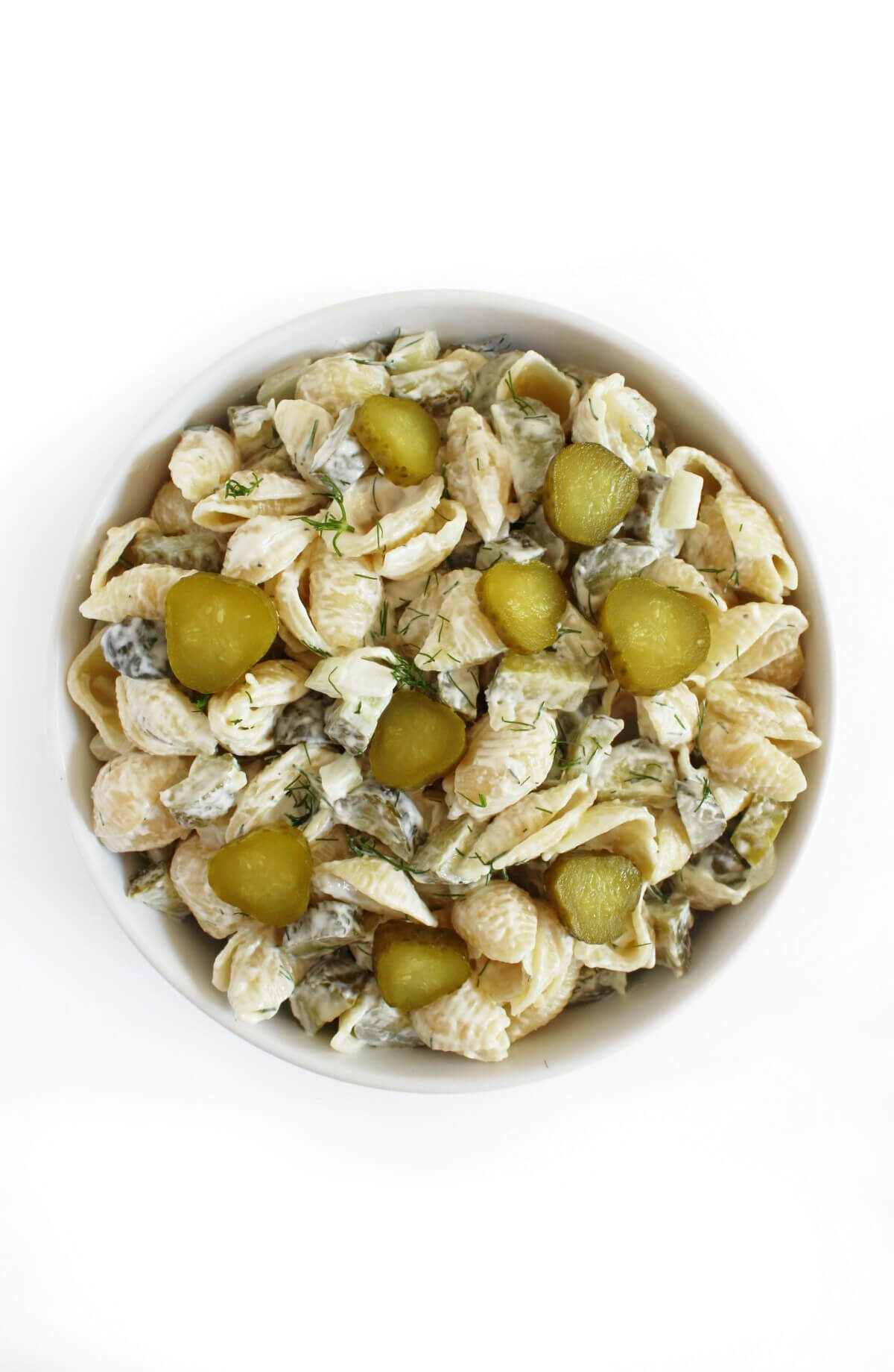healthy dill pickle pasta salad with extra pickle slices.