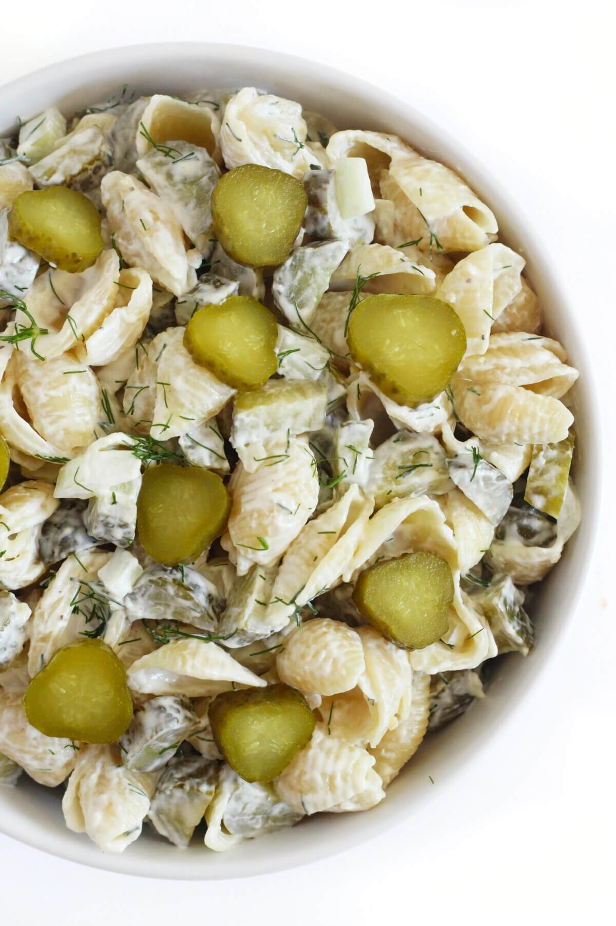 right overhead side of dill pickle pasta salad in serving bowl.