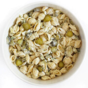 dill pickle pasta salad in large white serving bowl.