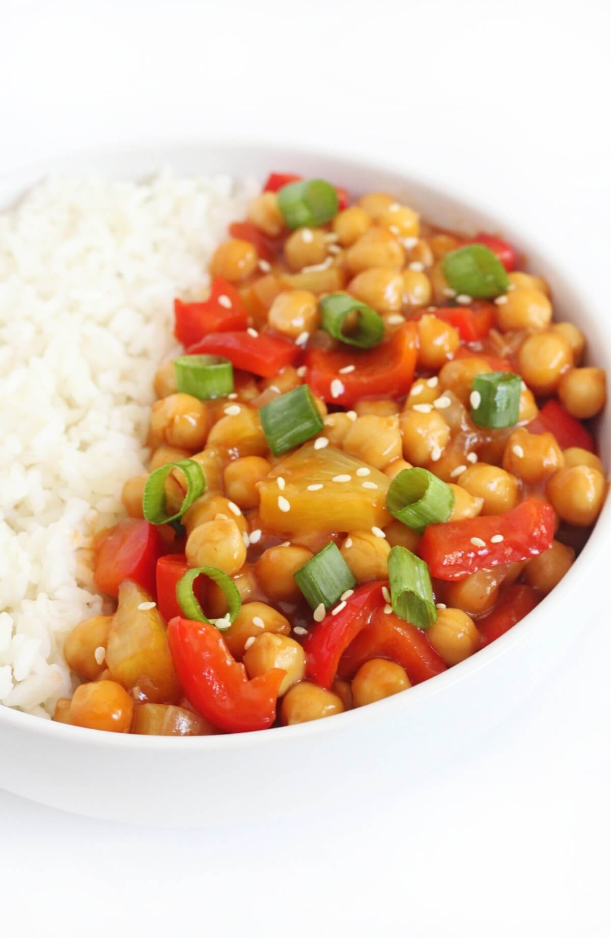sweet and sour chickpeas with sesame seeds and scallions to garnish.