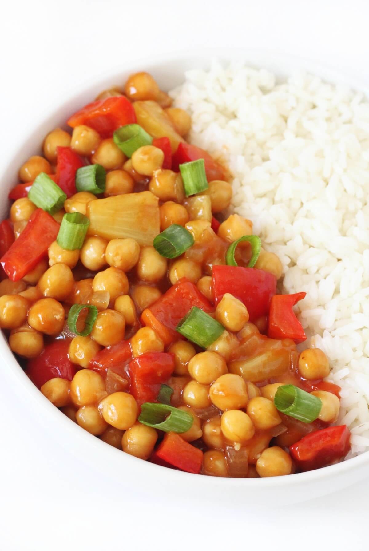 vegan sweet and sour chickpeas with white rice in bowl.