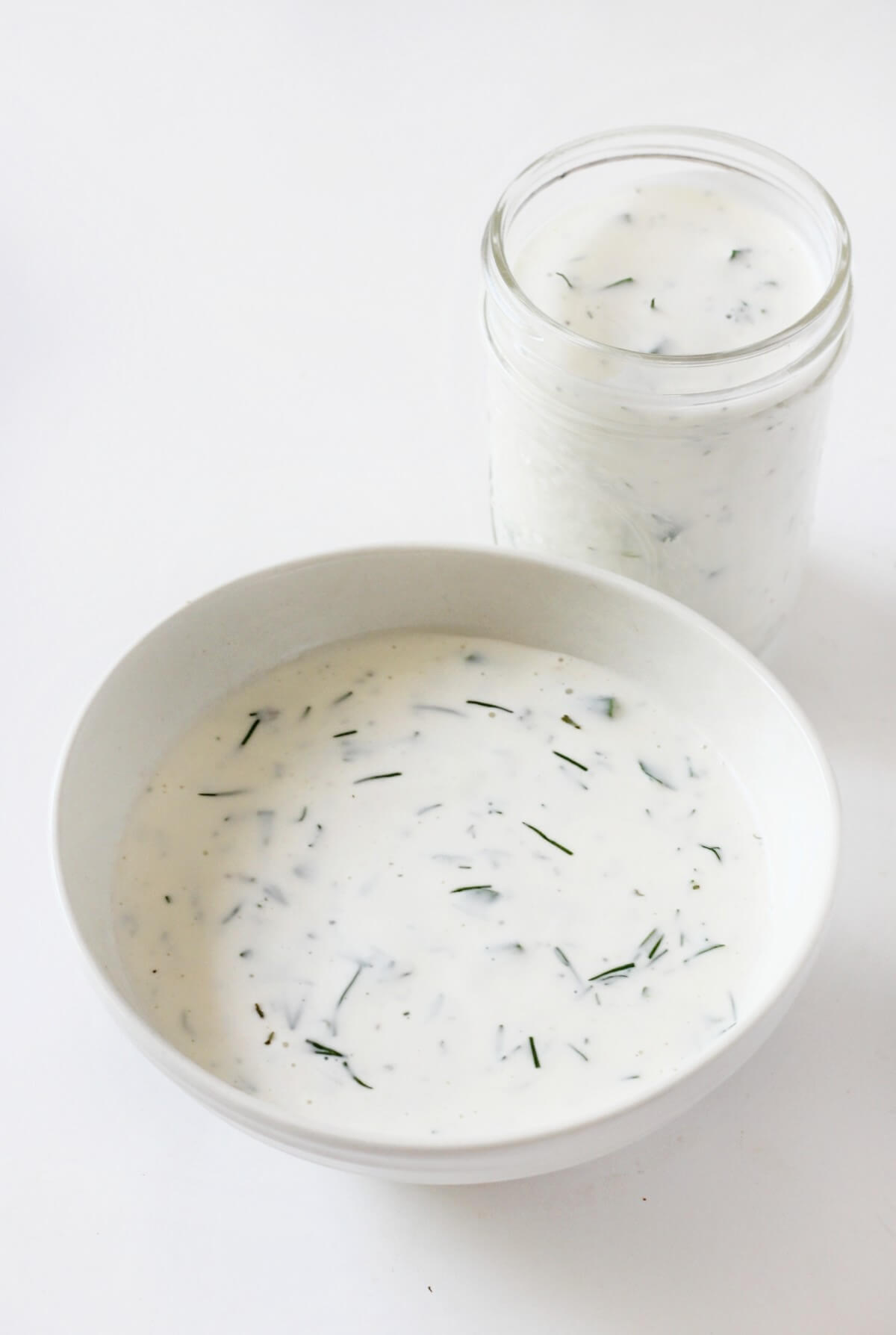 serving bowl and glass jar of homemade vegan ranch.