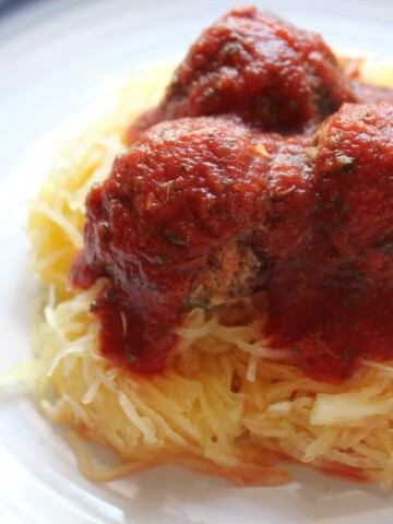 spaghetti squash with bean meatballs on plate.
