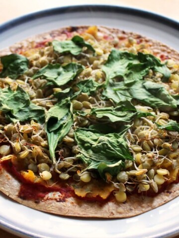 gluten-free sprouted lentil butternut squash tortilla pizza on plate.