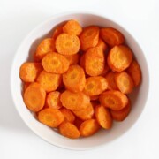 finished air fryer carrots in white bowl to serve.