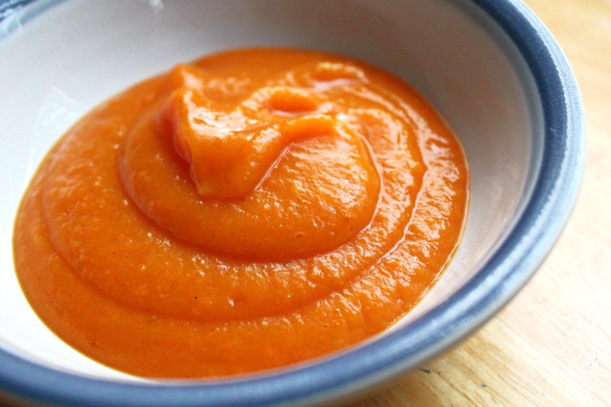 bowl of roasted butternut squash carrot soup without toppings.