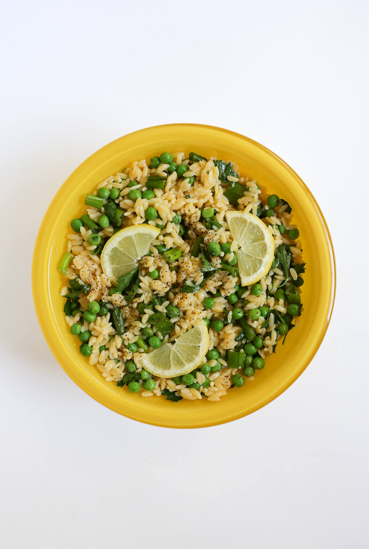 serving bowl with tossed gluten-free spring pasta salad.