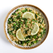 overhead serving bowl with gluten-free spring orzo pasta salad.