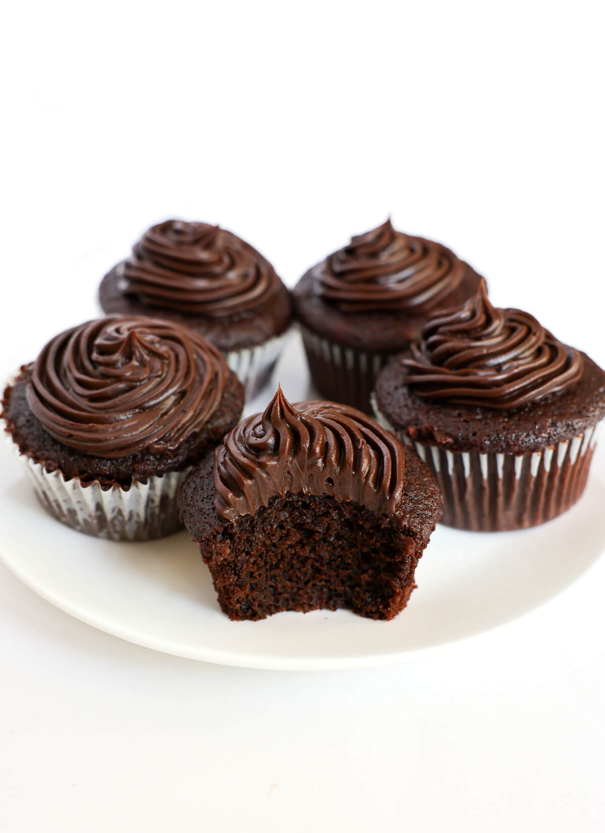 serving plate with gluten-free vegan chocolate cupcakes.