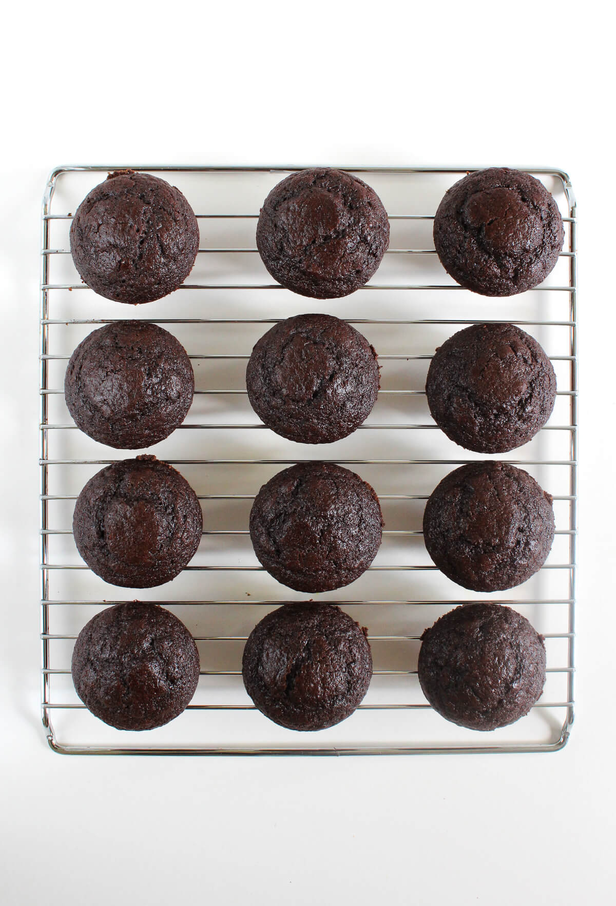 step 5 cooling gluten-free vegan chocolate cupcakes on rack.