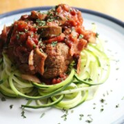 vegan meatballs and zucchini noodles on plate.